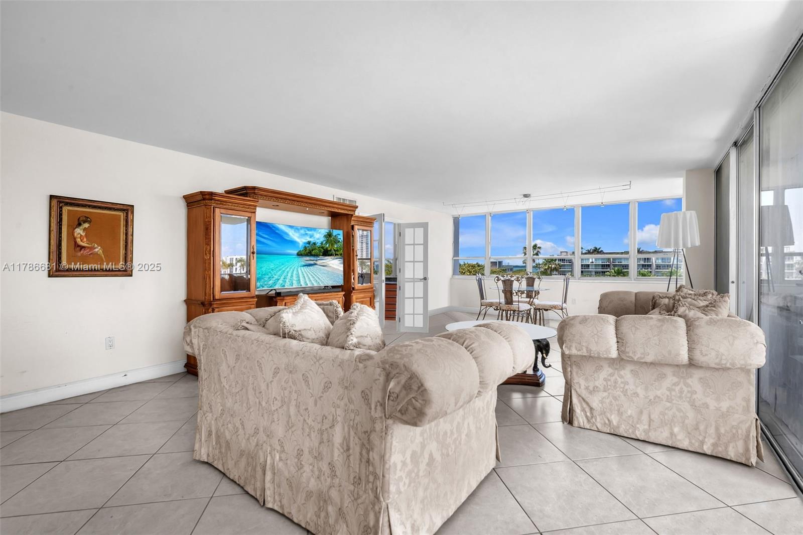 11 Island Avenue, Unit 512 Miami Beach, FL 33139 - Photo 3 of 54 a living room with furniture and a view of kitchen