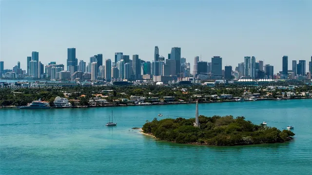 a view of a livingroom with furniture wooden floor and windows