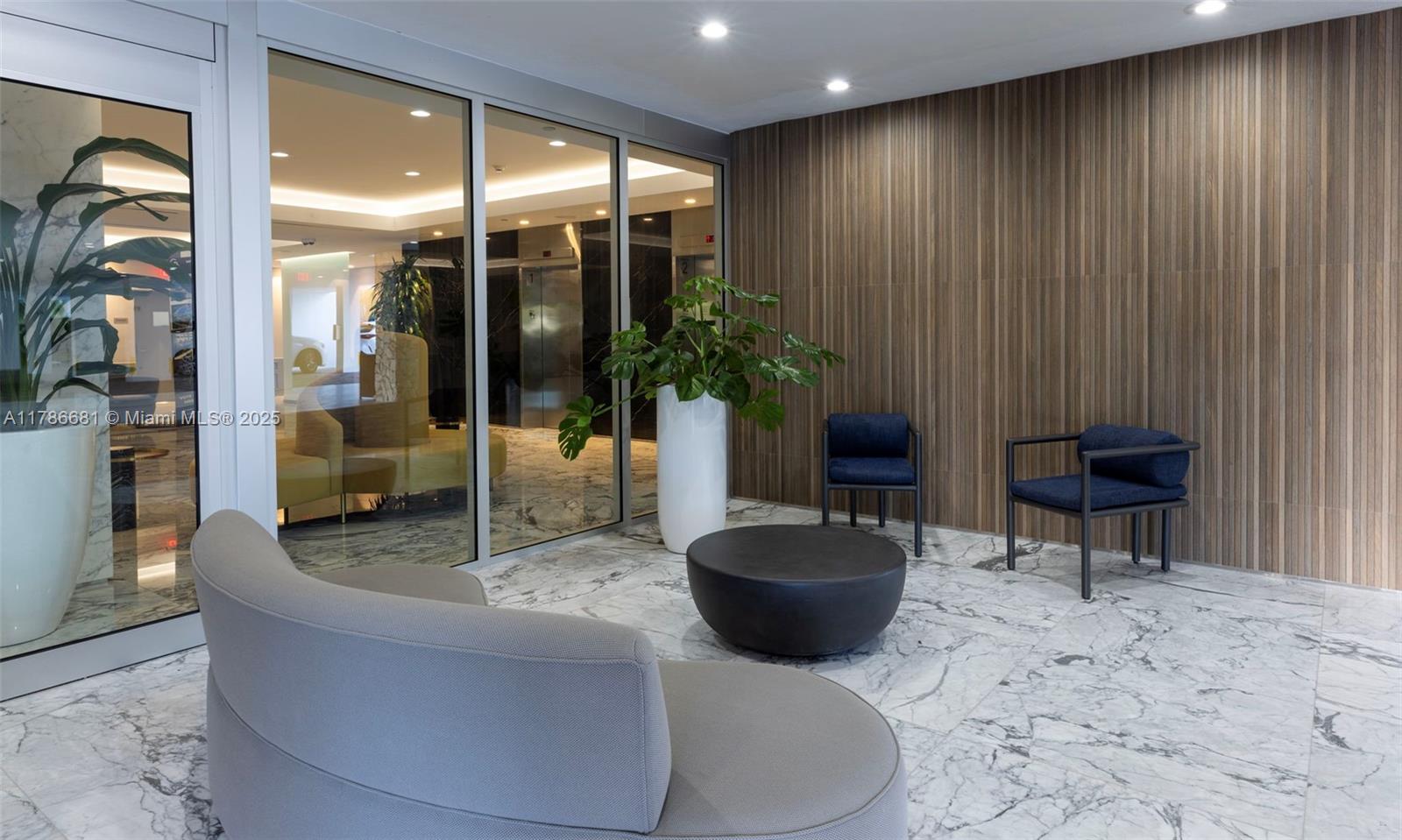 11 Island Avenue, Unit 512 Miami Beach, FL 33139 - Photo 35 of 54 a living room with furniture a potted plant and a shower