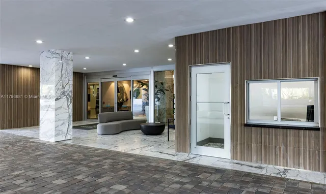 a living room with furniture and a piano