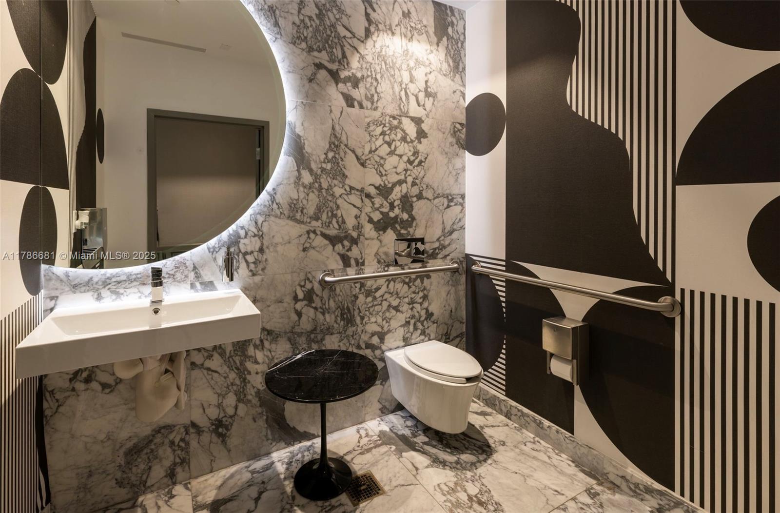 11 Island Avenue, Unit 512 Miami Beach, FL 33139 - Photo 44 of 54 a bathroom with a sink and a mirror