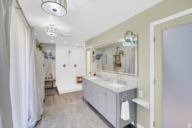 510 Spring Creek Road Providence, UT 84332 - Photo 26 of 97 Bathroom featuring a dual vanity with light gray cabinetry, white rectangular sinks, and a light-colored speckled countertop