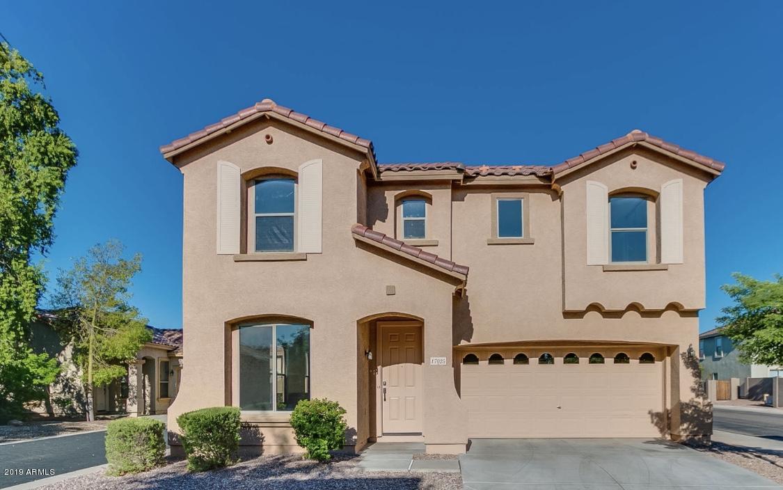 17025 West Rimrock Street Surprise, AZ 85388 - Photo 1 of 14 a front view of a house with a yard