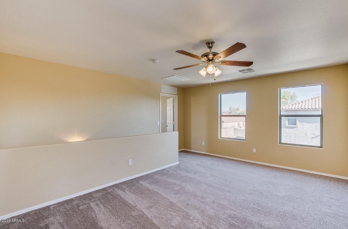 17025 West Rimrock Street Surprise, AZ 85388 - Photo 6 of 14 a view of an empty room with a window