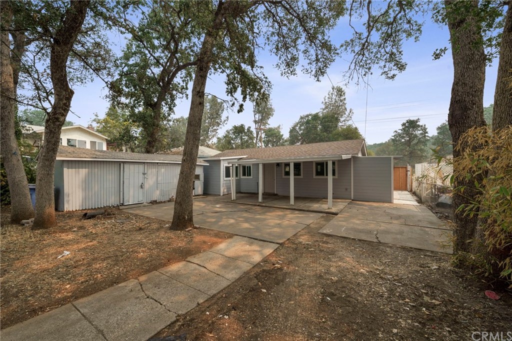 6436 Old Highway 53 Clearlake, CA 95422 - Photo 2 of 27 a front view of a house with a garden