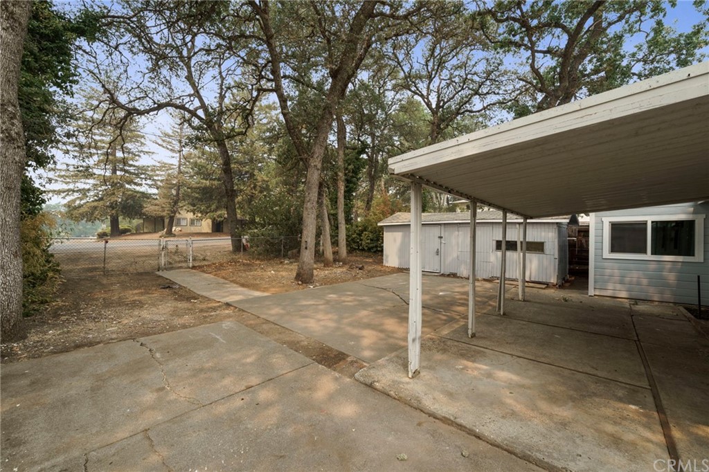 6436 Old Highway 53 Clearlake, CA 95422 - Photo 5 of 27 a view of a patio with table and chairs under an umbrella