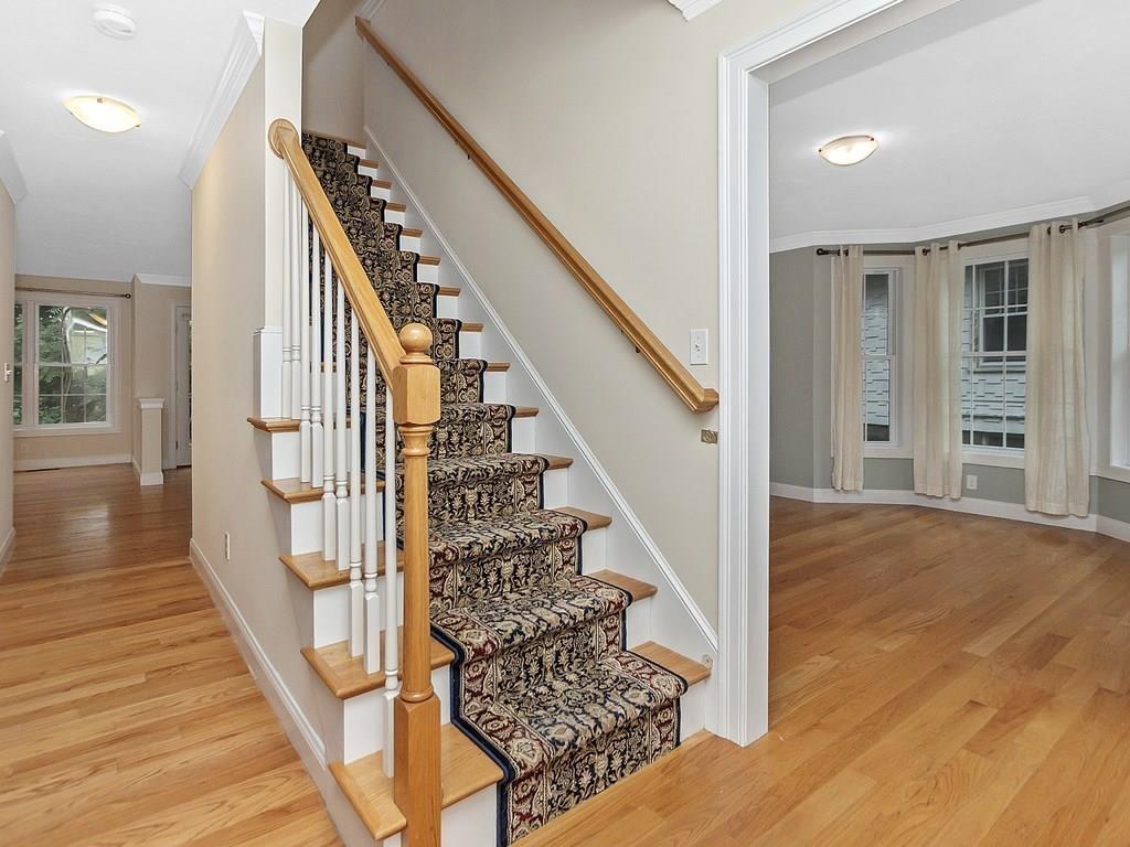 179 Florence Road Waltham, MA 02453 - Photo 16 of 37 a view of entryway and hall with wooden floor