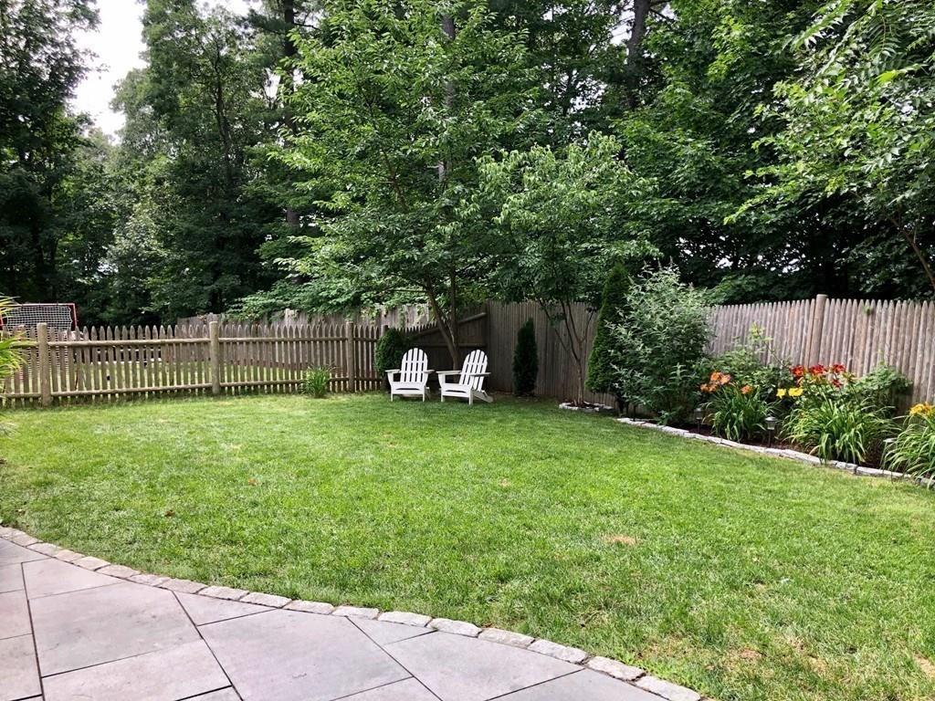 179 Florence Road Waltham, MA 02453 - Photo 29 of 37 a front view of a house with a yard