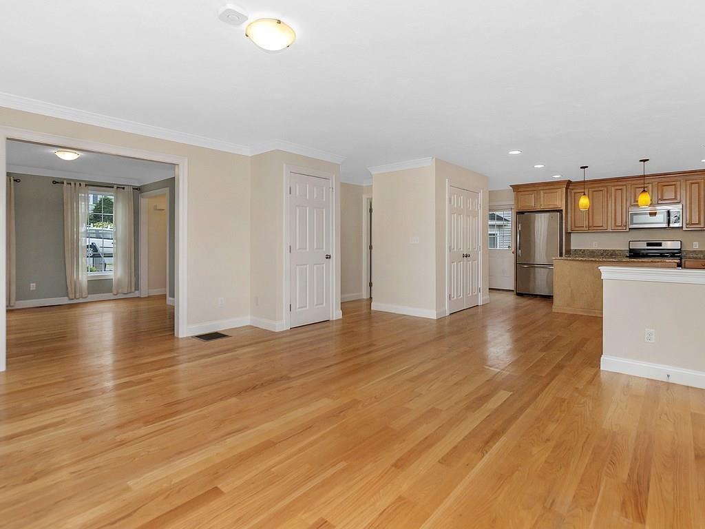 179 Florence Road Waltham, MA 02453 - Photo 8 of 37 a view of a kitchen with a sink and a refrigerator