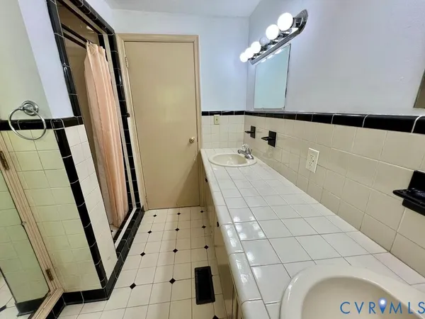 a utility room with cabinets washer and dryer