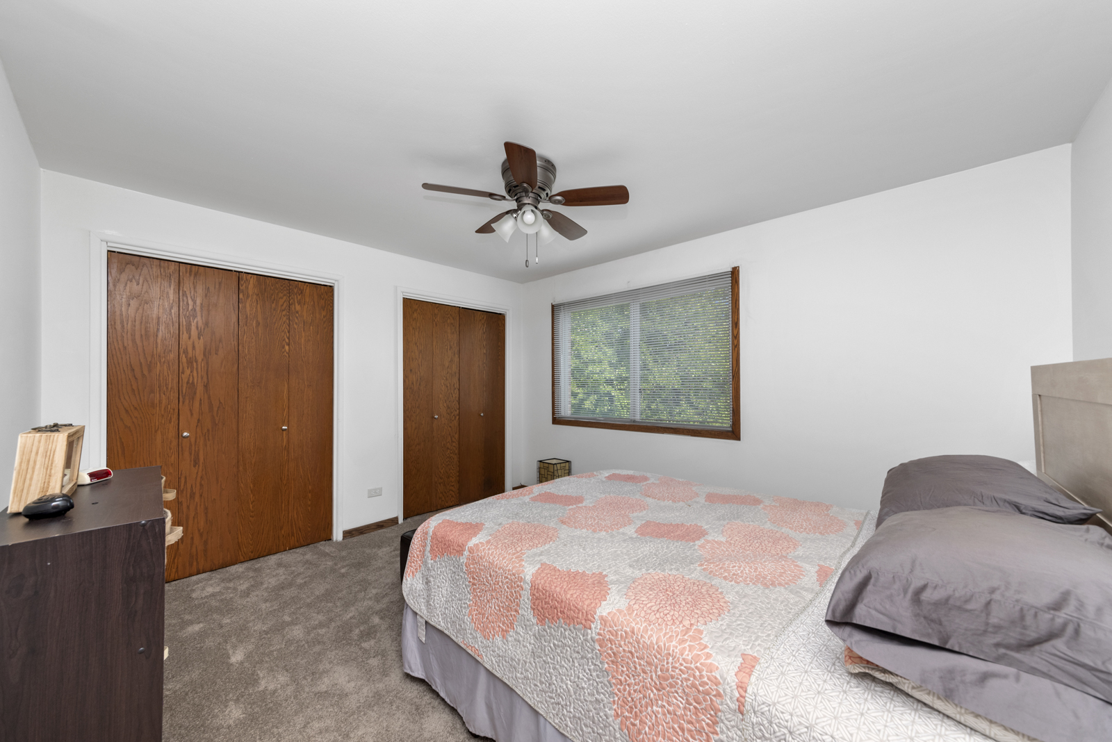 903 Elder Road, Unit 6 Homewood, IL 60430 - Photo 8 of 12 a bedroom with a bed and a chandelier