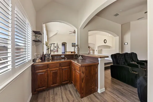 a kitchen with a sink and wooden cabinets