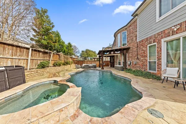 a view of a house with swimming pool