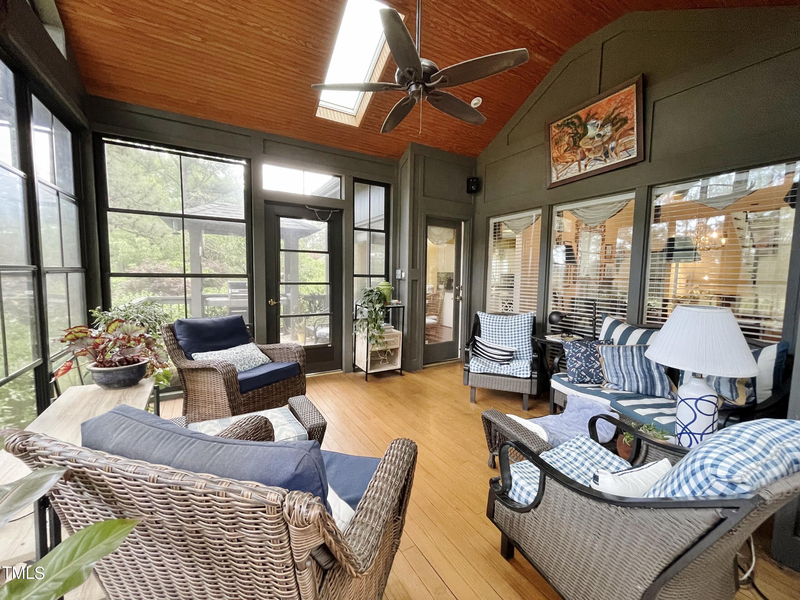 2924 Ballybunion Way Raleigh, NC 27613 - Photo 36 of 54 a living room with furniture and floor to ceiling windows