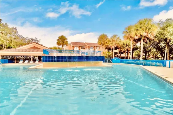 a view of a lake with houses in the back