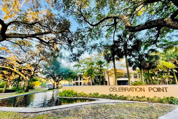 a street view with large trees
