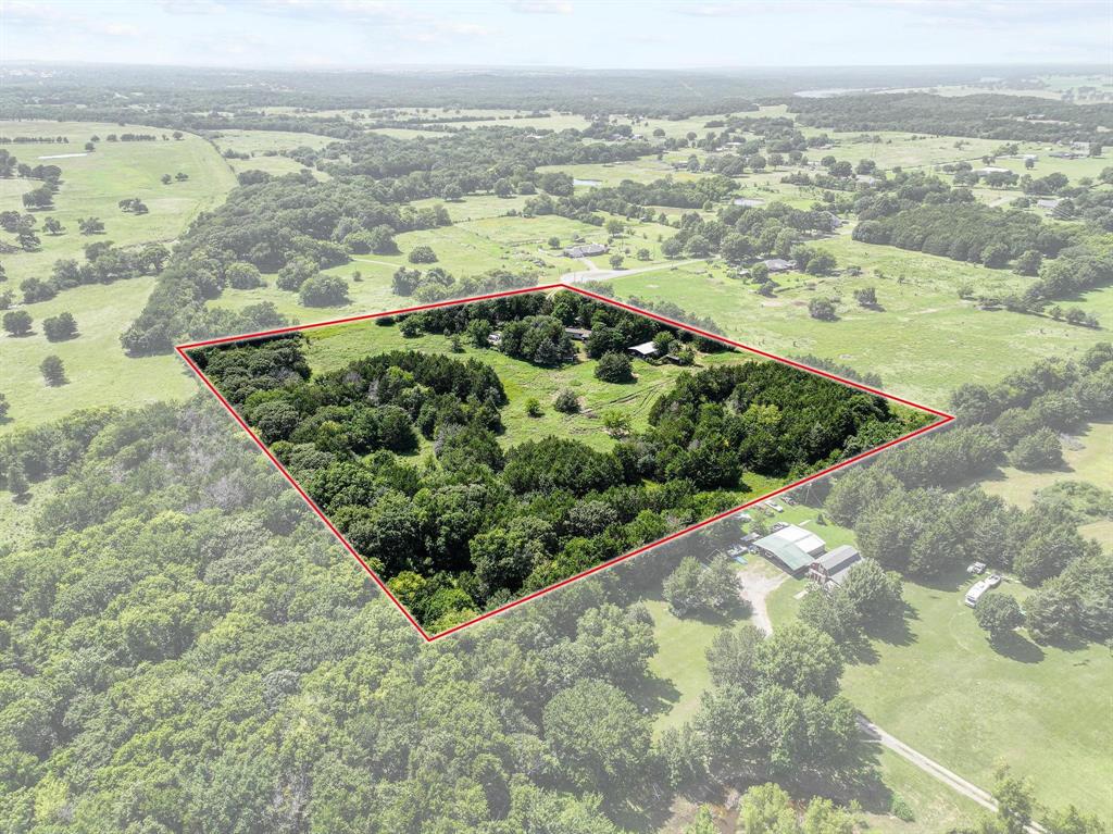 252 Meadow Lake Estates Road Denison, TX 75021 - Photo 35 of 37 Expansive rural acreage featuring a mix of mature trees and open grassy areas