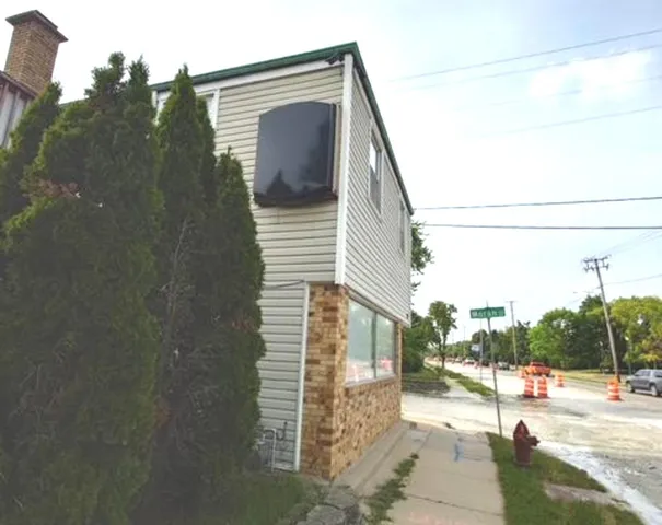 a view of a house with a street