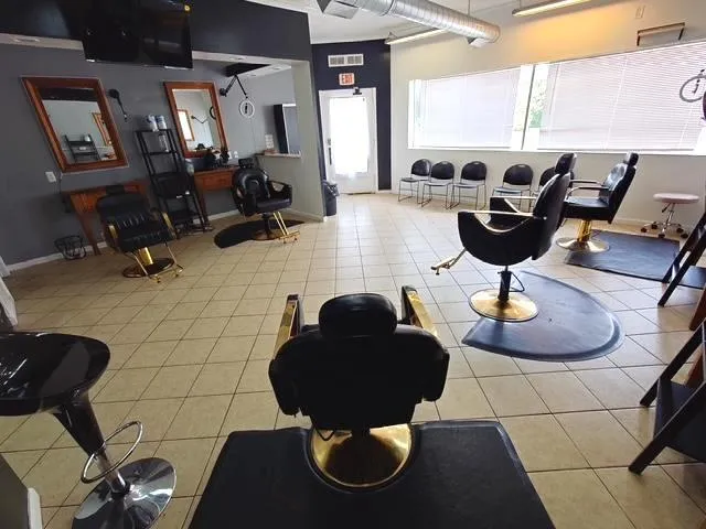 a living room with furniture a rug and white walls