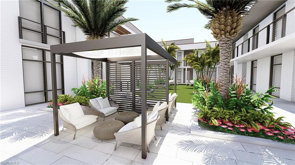 850 Central Avenue, Unit 209 Naples, FL 34102 - Photo 3 of 11 a view of a chair and table in the patio