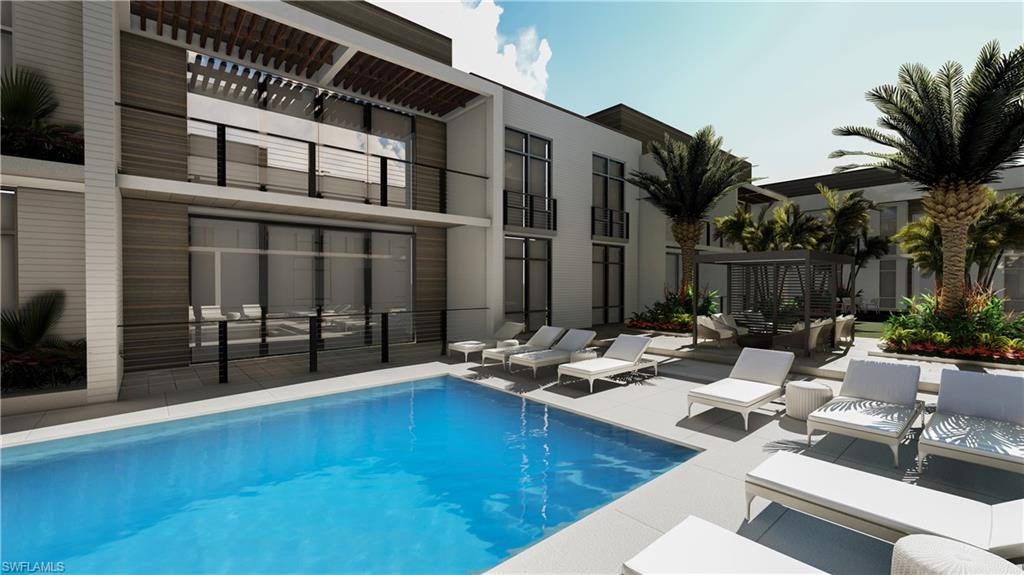 850 Central Avenue, Unit 209 Naples, FL 34102 - Photo 5 of 11 a view of a patio with swimming pool table and chairs