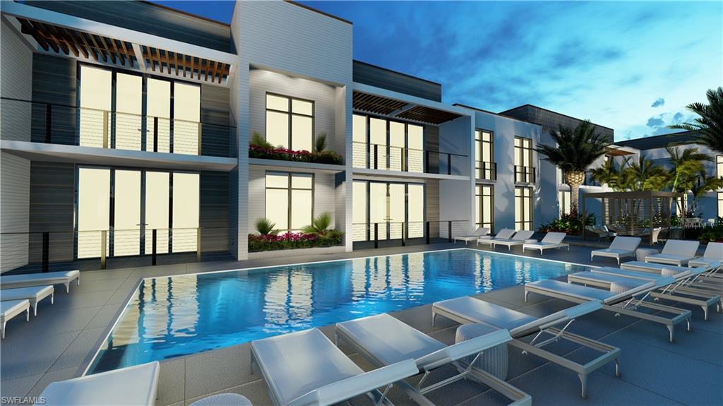 850 Central Avenue, Unit 209 Naples, FL 34102 - Photo 9 of 11 a dining room with wooden floor and large windows