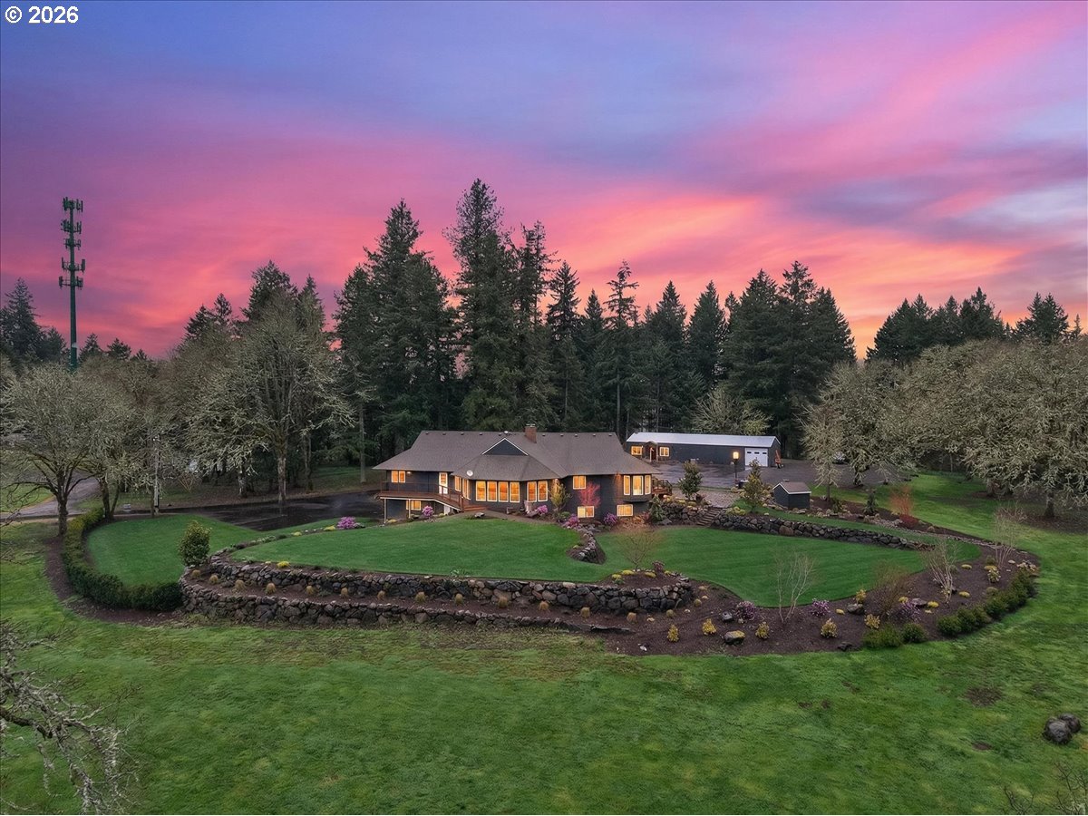 29009 Southwest Burkhalter Road Hillsboro, OR 97123 - Photo 1 of 48 a view of a garden with houses in the background