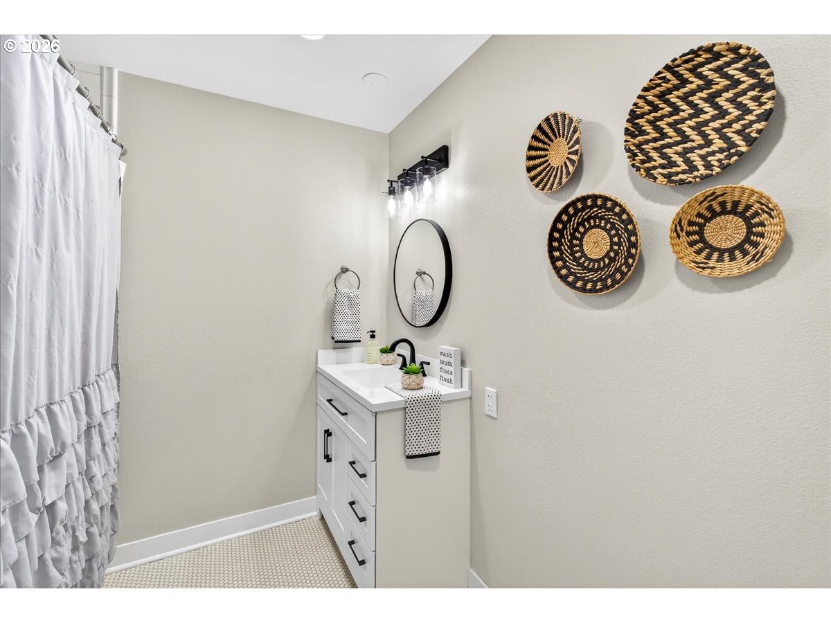 29009 Southwest Burkhalter Road Hillsboro, OR 97123 - Photo 19 of 48 a bathroom with a toilet and a sink