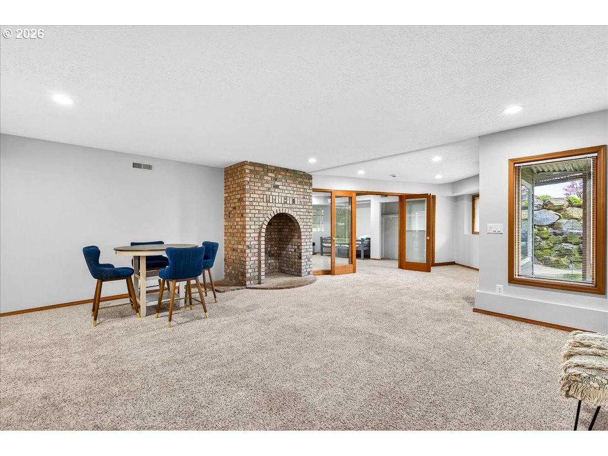 29009 Southwest Burkhalter Road Hillsboro, OR 97123 - Photo 23 of 48 a view of a livingroom with furniture and a fireplace