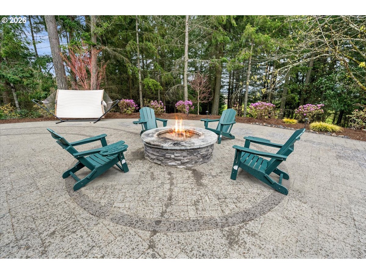 29009 Southwest Burkhalter Road Hillsboro, OR 97123 - Photo 31 of 48 a backyard of a house with fountain table and chairs