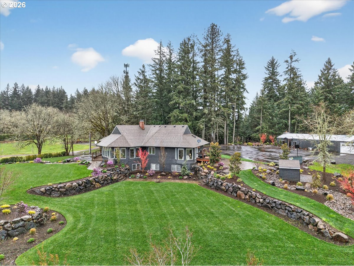 29009 Southwest Burkhalter Road Hillsboro, OR 97123 - Photo 45 of 48 a view of a house with a yard and sitting area