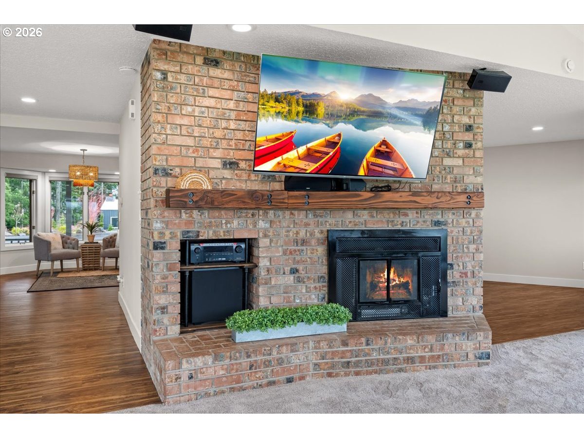 29009 Southwest Burkhalter Road Hillsboro, OR 97123 - Photo 5 of 48 a living room with furniture and a fireplace