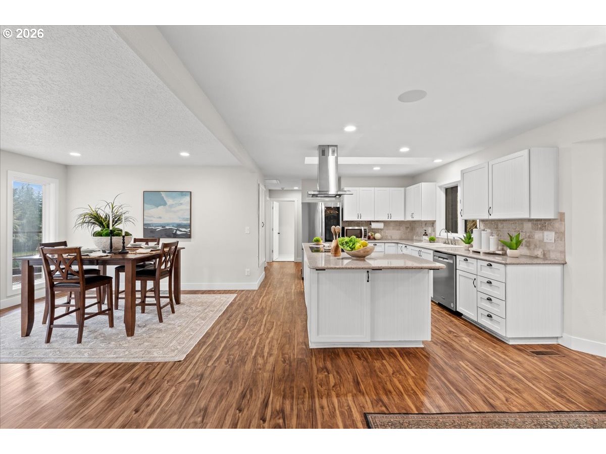 29009 Southwest Burkhalter Road Hillsboro, OR 97123 - Photo 9 of 48 a kitchen with a table and chairs in it