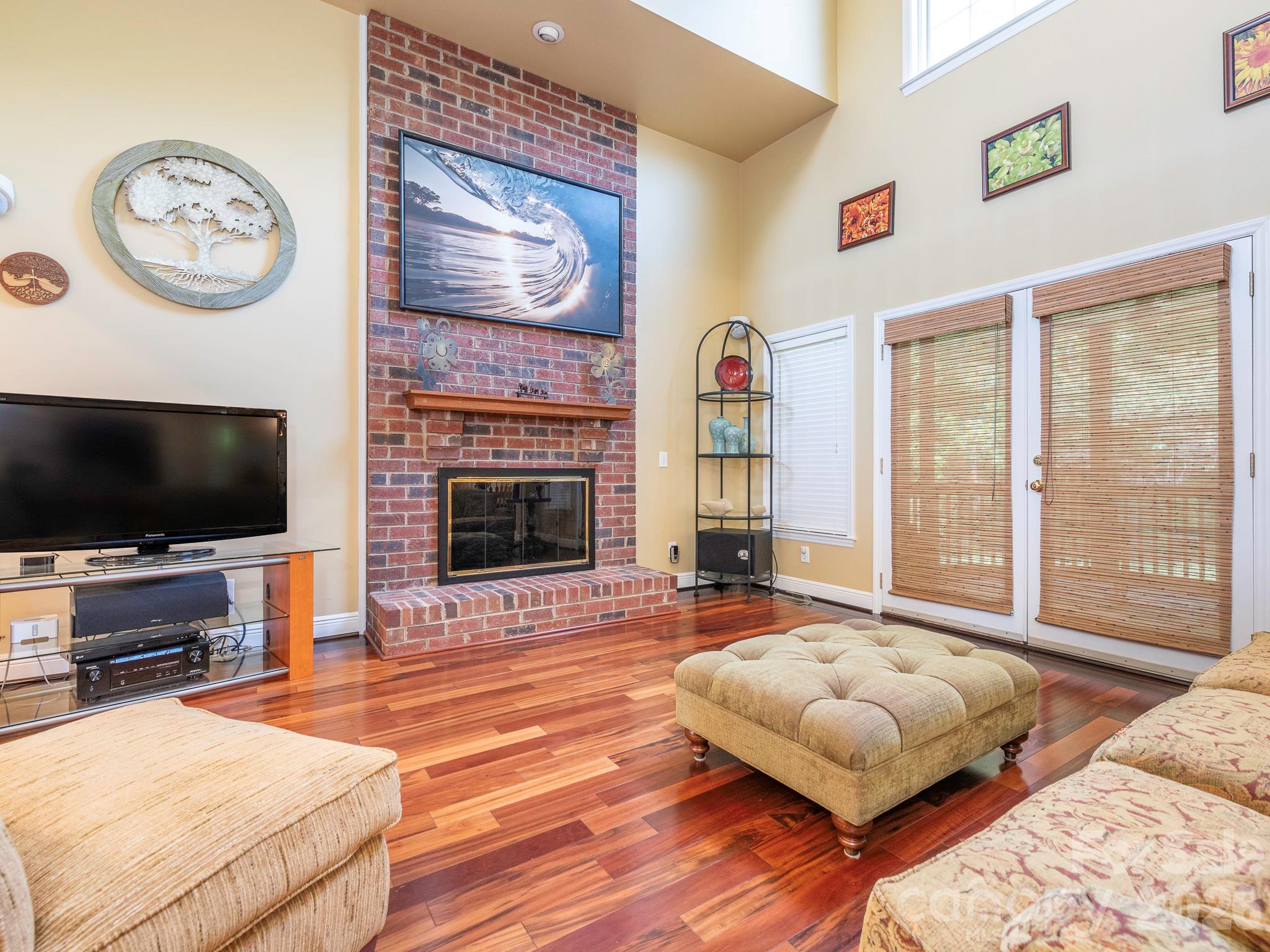 4440 Hucks Road Charlotte, NC 28269 - Photo 6 of 45 a living room with furniture and a flat screen tv