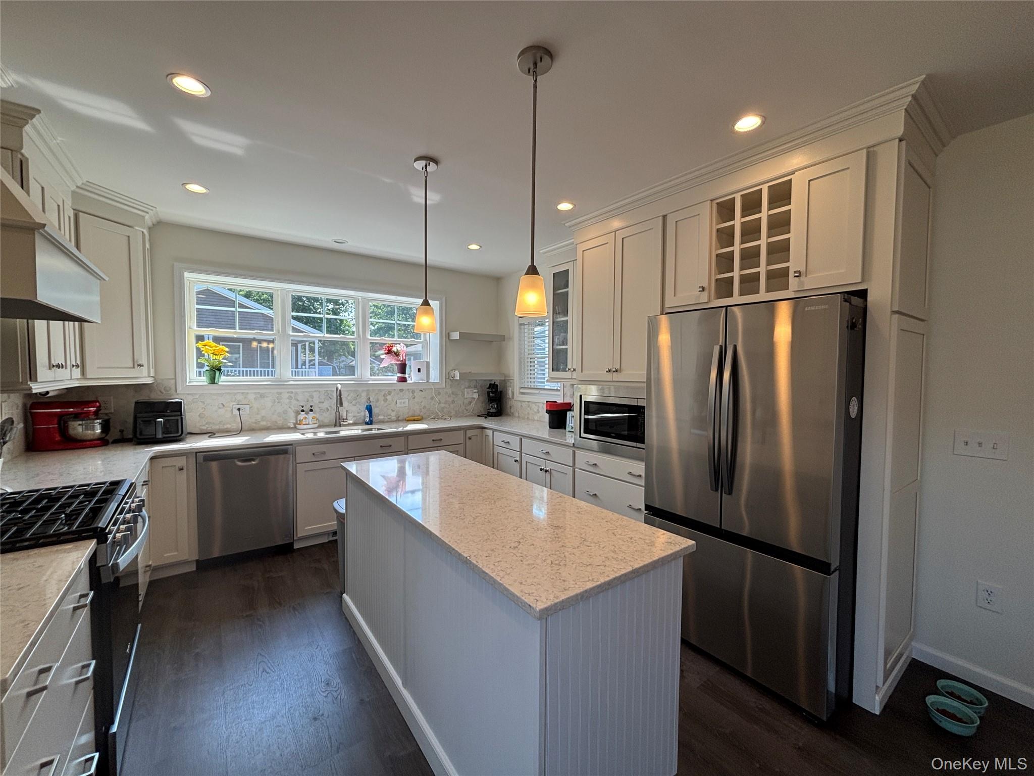 1661 Old Country Road, Unit 563 Riverhead, NY 11901 - Photo 13 of 43 a kitchen with refrigerator and window