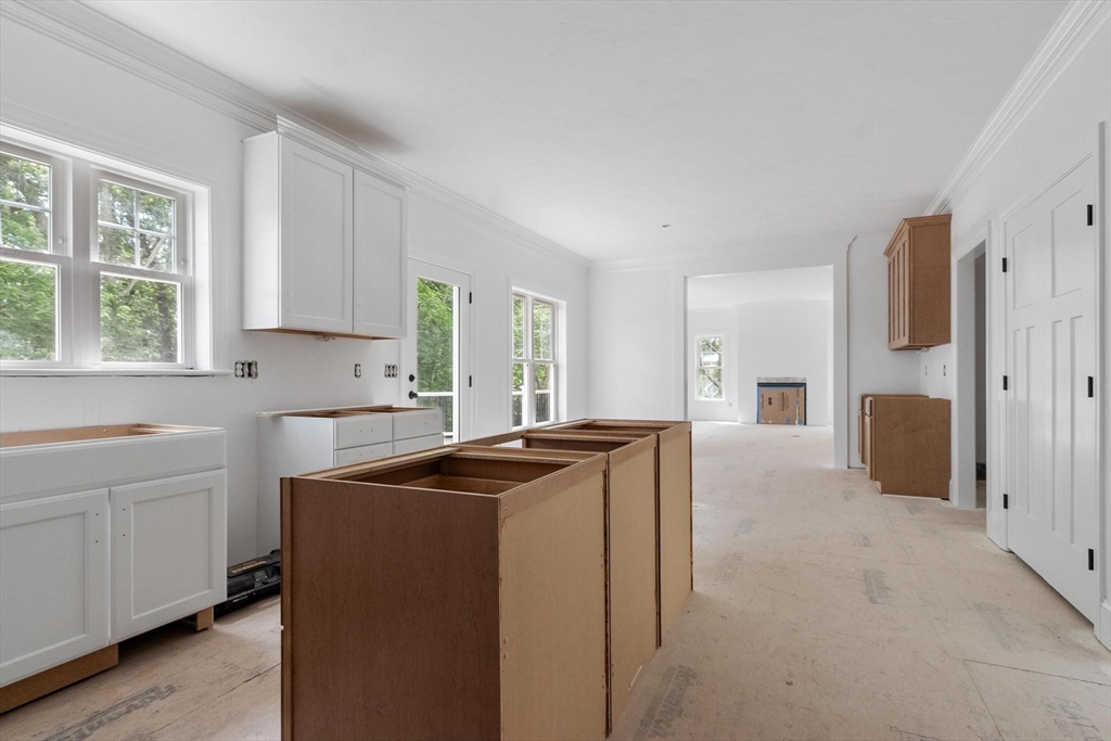37 Dogwood Road Littleton, MA 01460 - Photo 11 of 36 a kitchen with stainless steel appliances granite countertop a sink a stove and a refrigerator