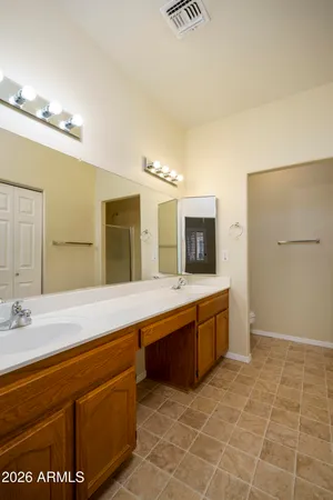 a large bathroom with a sink a large mirror and a bathtub