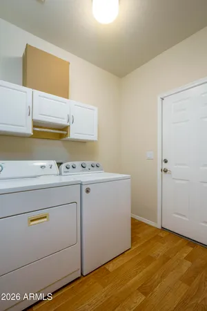 a view of storage and utility room with washer and dryer