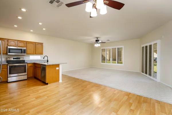 a view of kitchen with sink microwave and stove