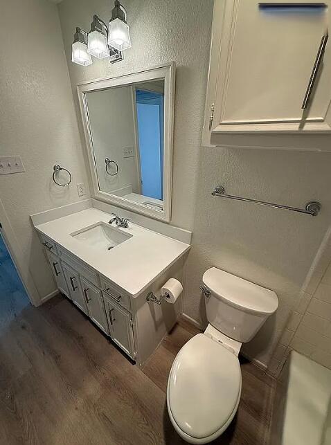 5232 95th Street Lubbock, TX 79424 - Photo 11 of 35 a bathroom with a toilet sink and mirror