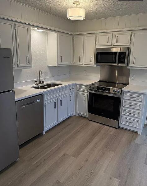 5232 95th Street Lubbock, TX 79424 - Photo 15 of 35 a kitchen with stainless steel appliances granite countertop a stove a sink and a microwave