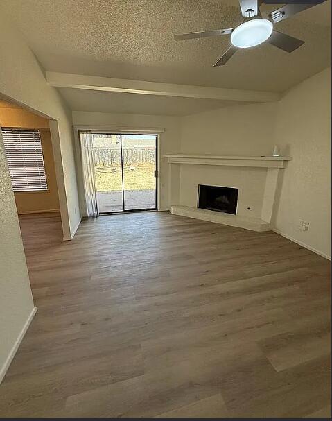 5232 95th Street Lubbock, TX 79424 - Photo 21 of 35 a view of a livingroom with wooden floor and window