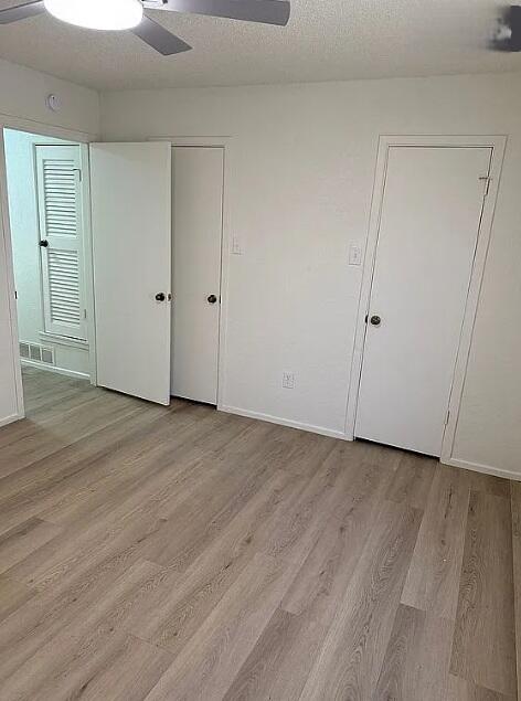 5232 95th Street Lubbock, TX 79424 - Photo 23 of 35 a view of an empty room with wooden floor