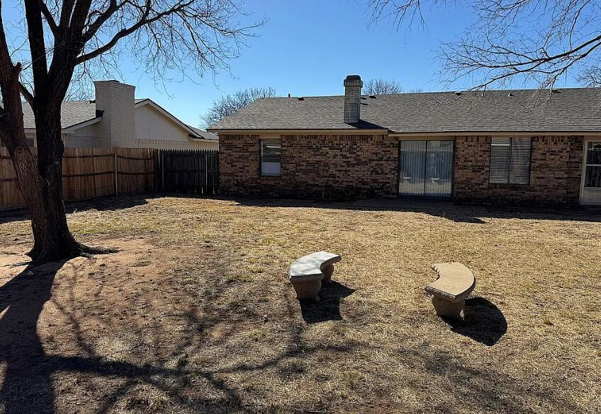 5232 95th Street Lubbock, TX 79424 - Photo 3 of 35 a view of a backyard of the house