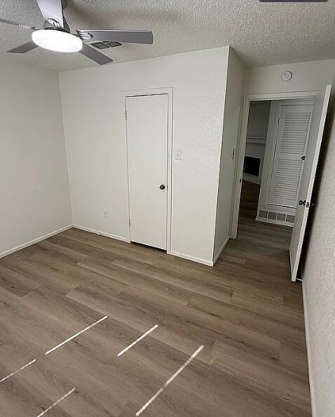5232 95th Street Lubbock, TX 79424 - Photo 31 of 35 a view of a room with wooden floor and white walls