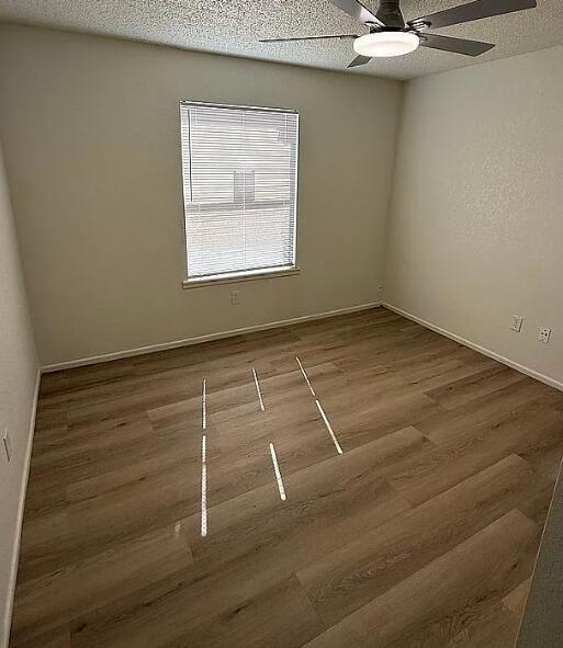 5232 95th Street Lubbock, TX 79424 - Photo 32 of 35 a room with a hardwood and a window