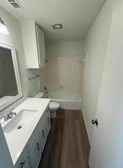 5232 95th Street Lubbock, TX 79424 - Photo 8 of 35 a bathroom with a sink a toilet and a mirror