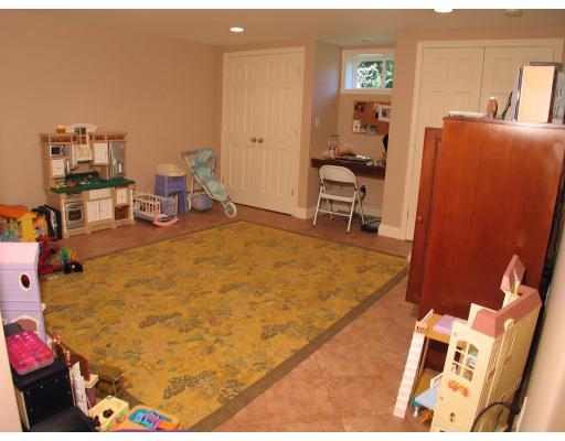 123 Johnson Road Winchester, MA 01890 - Photo 12 of 12 a bed room with a bed and a chair