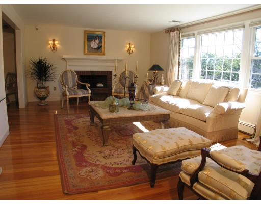 123 Johnson Road Winchester, MA 01890 - Photo 3 of 12 a living room with furniture a fireplace and a large window