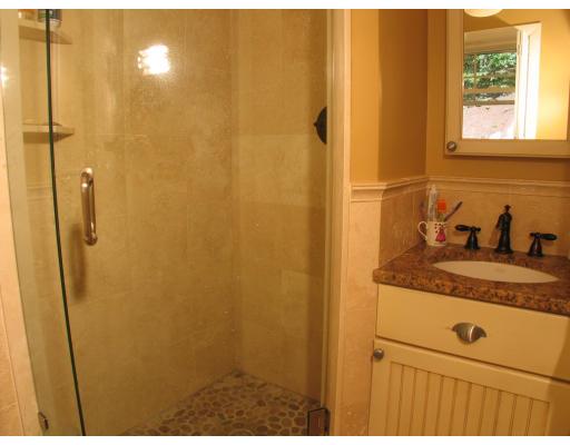123 Johnson Road Winchester, MA 01890 - Photo 8 of 12 a bathroom with a granite countertop sink and mirror